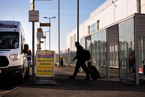 Passenger Getting in Flying Scot shuttle